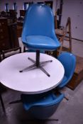 A vintage designer circular dining table and set of 4 similar teal vinyl dining chairs in the