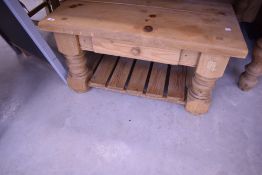 A natural pine coffee table having frieze drawer and undershelf, approx. 91 x 91cm