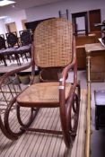 A traditional bentwood and canework rocking chair