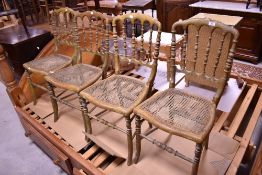 A set of four bedroom or similar chairs , in tha classical style with turned spindle backs and