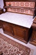 A 19th Century mahogany washstand having tiled back with towel rail, width approx. 123cm