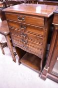 A Victorian/Art Nouveau mahogany music cabinet having five drawers and undershelf, dimensions