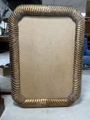 A modern gilt effect wall mirror surround (no glass), approx. 110 x 80cm