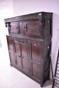 A period oak court cupbpoard of shallow design, approx dimensions. W147 H174 D39cm