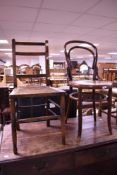 A Victorian cane seated bedroom chair (af) and a traditional bentwood dining chair