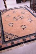A Chinese carpet square having peach ground with typical chinoiserie design, approx 300 x 207cm