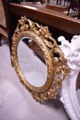 A gilt frame foliate wall mirror, approx. 85 x 85cm