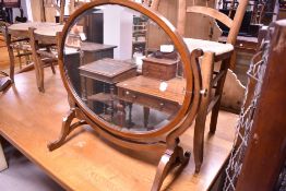 An Edwardian mahogany toilet mirror, width approx. 72cm