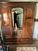 An Edwardian mahogany mirror door wardrobe, having inlay decoration and drawer base