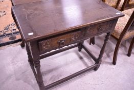 A Priory style oak side table having two frieze drawers, width approx. 75cm