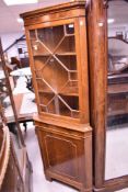 A reproduction Regency style mahogany corner display