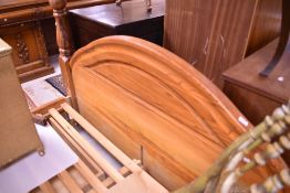 A modern pine bed with drawers under
