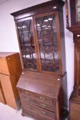 A 19th Century Georgian style mahogany bureau bookcase, having glazed top, height approx. 204cm,