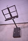 A 19th Century rustic music stand with step to base