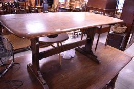 A dark stain Ercol refectory style dining table, approx. 153 x 76cm
