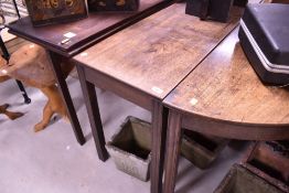 A 19th Century mahogany banquetting table having two D ends , Centre piece and two additional