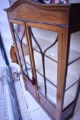 An Edwardian mahogany display cabinet having typical inlaid decoration, width approx. 92cm