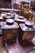 Five vintage toleware tea canisters , having oriental style decoration, height approx. 42cm