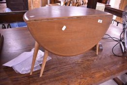 A vintage Ercol gateleg occasional table, width approx. 61cm