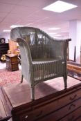 A traditional Lloyd loom tub chair