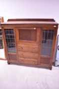 An early 20th oak side by side bureau bookcase, width approx. 127cm