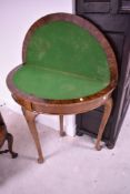 An early 20th Century walnut fold over card table in the Queen Anne style, width approx. 91cm