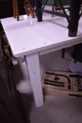 A modern shop display table, white powder coated, approx. 243 x 121cm