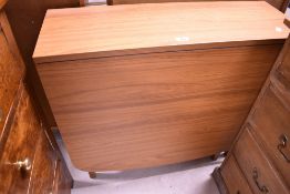 A laminate gateleg dining table