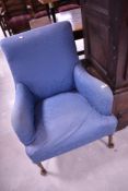 An early 20th Century low seat easy chair