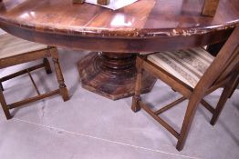A hardwood circular dining table on large turned base, diameter approx. 172cm