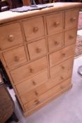 A natural pine chest of merchants style drawers, approx dimensions W79 D33 H113cm