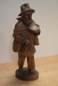 A 20th Century Continental wooden figural ornament, of Folk Art style and depicting an elderly,
