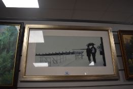 A seaside prom scene signed by John Cooke framed and glazxed 64cm x 38cm overall.