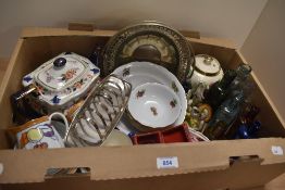 An Art Deco figurine of a Lady with a Sun Bonnet, a small selection of medicine bottles, a silver