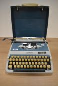 A vintage Imperial 202 typewriter with hard case and instruction manual.
