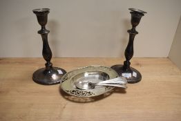 A pair of Edwardian style plated candlesticks engraved 'JEC' to base within a lorrel reef, sold