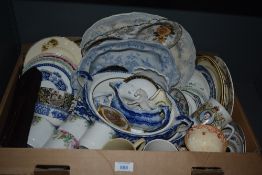 A carton of assorted plates, saucers and cups including blue and white ware.