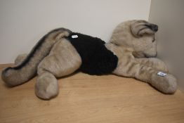 A vintage Harris Merrythought German Shepherd toy.