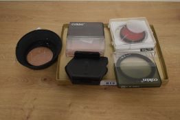 A selection of camera filters and attachments
