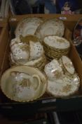 A pretty 20th century part tea service having approximately 33 pieces with gilt edging and blossom