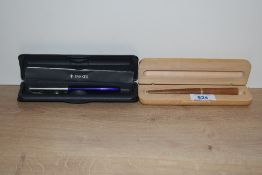 A boxed Parker Frontier rollerball pen in blue with lustraloy cap and a wooden cartridge fill