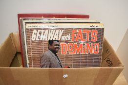 A small selection of vintage album records including Fats Domino, Roberta Flack, The Beach Boys