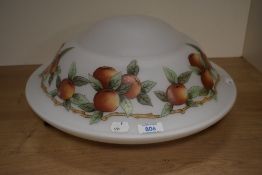 A vintage glass flycatcher lamp shade in white and having hand painted apple design.