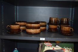 Six retro treacle glazed teacups and saucers and matching bowls