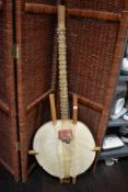A West African Kora stringed musical instrument, measuring 130cm long