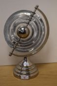 A modern decorative Armillary sphere/celestial model desk ornament, with five 'rings' raised on a