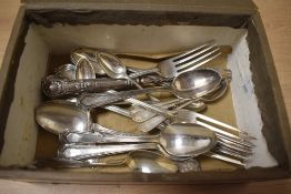 An early 20th Century Cadbury's confectionary box containing assorted silver plated flatware