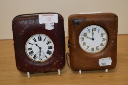 Two large pocket watches within cases, one in tan the other in oxblood with 'J.D.G.P 1904' to the