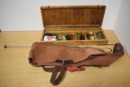 A Gun Cleaning Kit for a Rifle or a Shotgun in a fitted wooden case with a canvas and leather gun