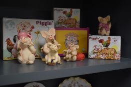 Five boxed Piggin collectable pig studies including 'Piggin' Special', 'Piggin' Luv'd Up', and '